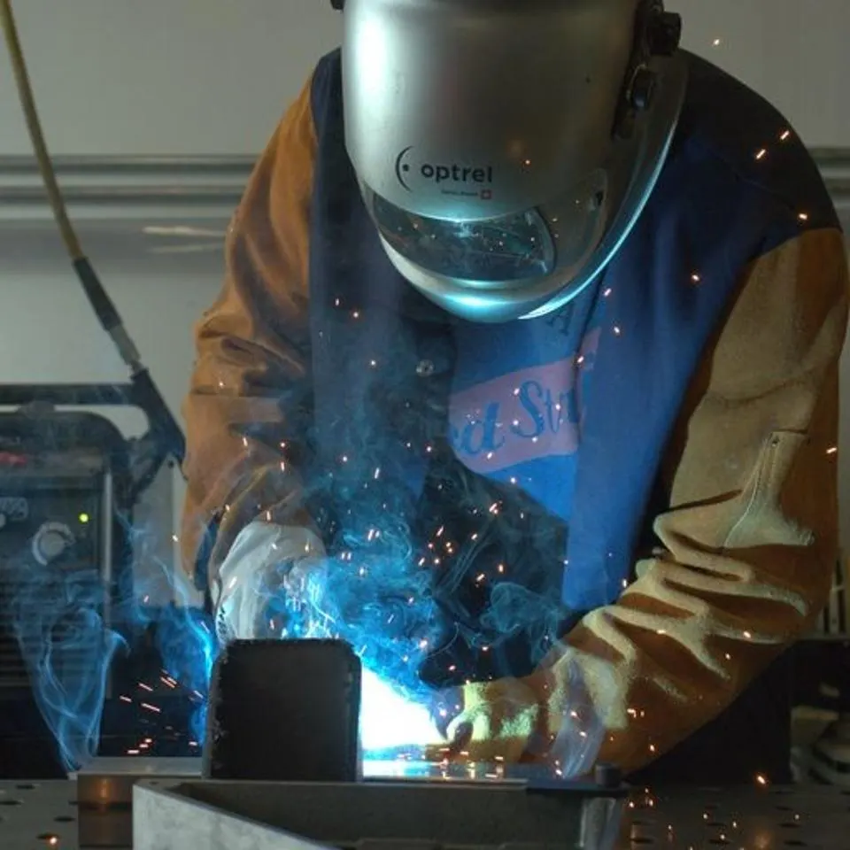 Nik Sears wears safety gear and welds work for Modern Hydrogen's technology